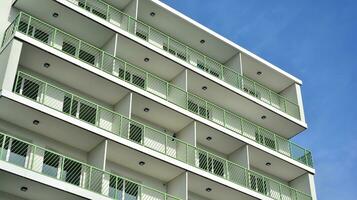 Condominium and apartment building with  symmetrical modern architecture in the city downtown. photo