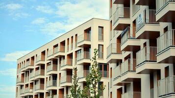 Condominium and apartment building with  symmetrical modern architecture in the city downtown. photo