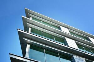 Modern building.Modern office building with facade of glass photo