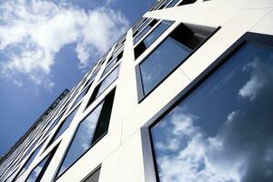 Modern building.Modern office building with facade of glass photo