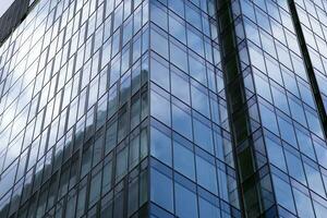 Modern building.Modern office building with facade of glass photo