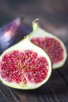 Fresh figs on the wooden background photo