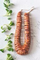 Spanish chorizo on the white background photo