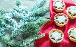 Mince pies with Christmas tree branch photo