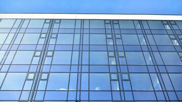 Modern building.Modern office building with facade of glass photo