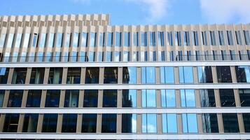 Modern building.Modern office building with facade of glass photo