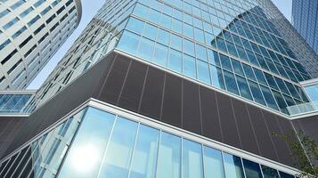 Modern building.Modern office building with facade of glass photo