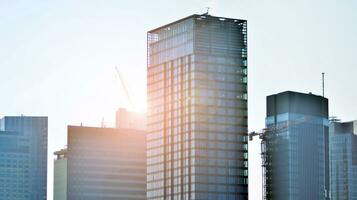 Modern building.Modern office building with facade of glass photo