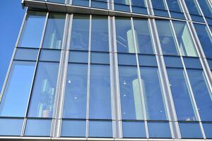 Modern building.Modern office building with facade of glass photo