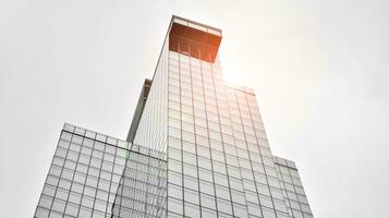 Glass modern building with blue sky background. View and architecture details. Urban abstract - windows of glass office building in  sunlight day. Black and white. photo