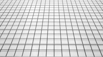 Glass modern building with blue sky background. View and architecture details. Urban abstract - windows of glass office building in  sunlight day. Black and white. photo