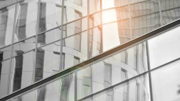 Glass modern building with blue sky background. View and architecture details. Urban abstract - windows of glass office building in  sunlight day. Black and white. photo