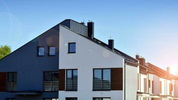 New build single family house. Suburban area with modern geometric family house. photo