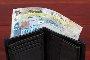 Bahraini money in the black wallet photo