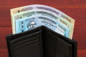 Currency of Bangladesh in the black wallet photo