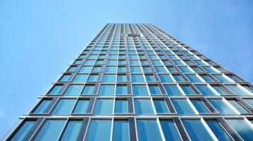 Modern building.Modern office building with facade of glass photo