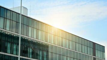 Modern building.Modern office building with facade of glass photo