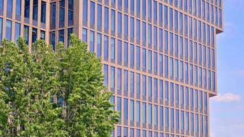 Modern building.Modern office building with facade of glass photo