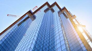 Modern building.Modern office building with facade of glass photo