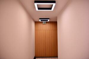 Modern lighting in the hallway of a modern building.Modern flat design. Modern building design. photo