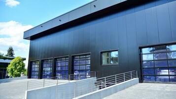 Facade of a modern navy blue warehouse photo