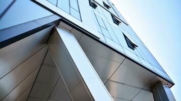 Combination of metal and glass wall material. Steel facade on columns. Abstract modern architecture. High-tech minimalist office building. Contemporary business architecture abstract fragment. photo