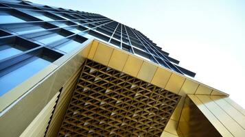 Combination of metal and glass wall material. Steel facade on columns. Abstract modern architecture. High-tech minimalist office building. Contemporary business architecture abstract fragment. photo