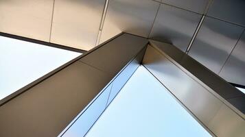 Combination of metal and glass wall material. Steel facade on columns. Abstract modern architecture. High-tech minimalist office building. Contemporary business architecture abstract fragment. photo