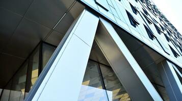 Combination of metal and glass wall material. Steel facade on columns. Abstract modern architecture. High-tech minimalist office building. Contemporary business architecture abstract fragment. photo