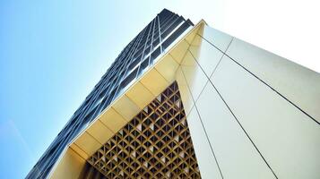 Combination of metal and glass wall material. Steel facade on columns. Abstract modern architecture. High-tech minimalist office building. Contemporary business architecture abstract fragment. photo