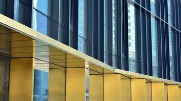 Combination of metal and glass wall material. Steel facade on columns. Abstract modern architecture. High-tech minimalist office building. Contemporary business architecture abstract fragment. photo