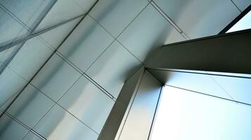 Combination of metal and glass wall material. Steel facade on columns. Abstract modern architecture. High-tech minimalist office building. Contemporary business architecture abstract fragment. photo