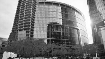 View of a skyscraper under construction. Modern architecture background. Building a high-rise building,  the concept of real estate construction. Black and white. photo