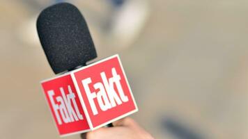 Warsaw, Poland. 24 October 2023. Microphone with the logo of the TV news  channel. Sign Fakt. photo