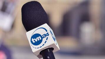 Warsaw, Poland. 24 October 2023. Microphone with the logo of the TV news  channel. Sign TVN24. photo