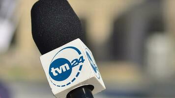 Warsaw, Poland. 24 October 2023. Microphone with the logo of the TV news  channel. Sign TVN24. photo