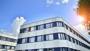 Office building with white aluminum composite panels. Facade wall made of glass and metal. Abstract modern business architecture. photo