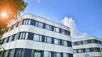 Office building with white aluminum composite panels. Facade wall made of glass and metal. Abstract modern business architecture. photo