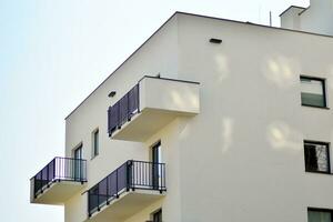 Modern apartment buildings on a sunny day with a blue sky. Facade of a modern apartment building photo