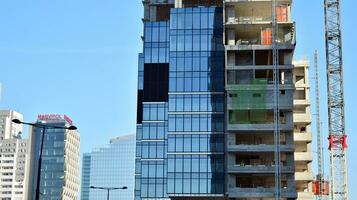 High-rise building under construction. Modern office building. photo