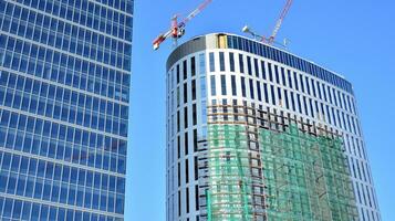 High-rise building under construction. Modern office building. photo