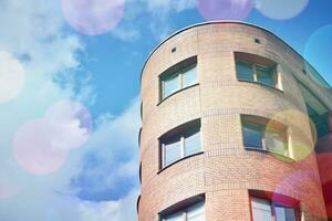 Modern apartment buildings on a sunny day with a blue sky. Facade of a modern apartment building photo
