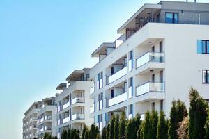 Residential Building on sky background. Facade of a modern housing construction with of balconies. photo