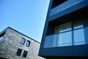 Residential Building on sky background. Facade of a modern housing construction with of balconies. photo