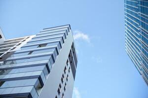 Residential Building on sky background. Facade of a modern housing construction with of balconies. photo