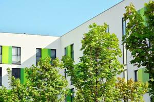 Residential Building on sky background. Facade of a modern housing construction with of balconies. photo