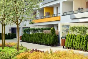 Residential Building on sky background. Facade of a modern housing construction with of balconies. photo