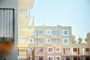 Residential Building on sky background. Facade of a modern housing construction with of balconies. photo