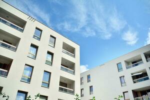 Residential Building on sky background. Facade of a modern housing construction with of balconies. photo