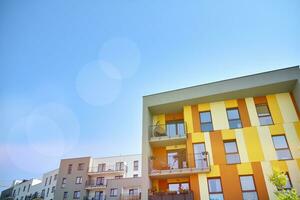 Residential Building on sky background. Facade of a modern housing construction with of balconies. photo